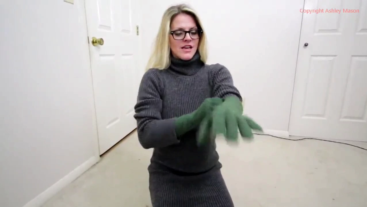 Items of clothing (specifically, gloves) with a shade of green porn video